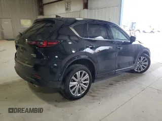 2023 Mazda CX-5 Signature with VIN JM3KFBXY6P0235017, listed as a Copart auction lot 45979615 with 14,487 mi miles and Salvage Title. Bid and sale history available at carsss.com. Image 3.