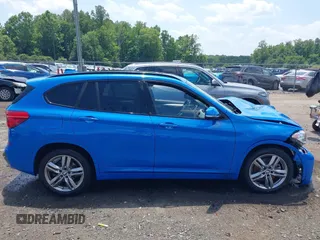 2021 BMW X1 xDrive28i with VIN WBXJG9C04M5T61811, listed as a IAAI auction lot 42509852 with 30,400 mi miles and . Bid and sale history available at DreamBid. Image 13.