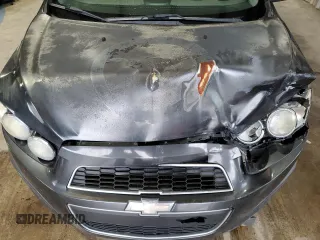 2014 Chevrolet Sonic LT z VIN 1G1JC5SH1E4118997, wystawiony jako Copart lot #70792334 z przebiegiem 166 691 mil mil oraz Szkoda całkowita • Salvage title. Historia ofert i sprzedaży dostępna na DreamBid. Obrazek 11.