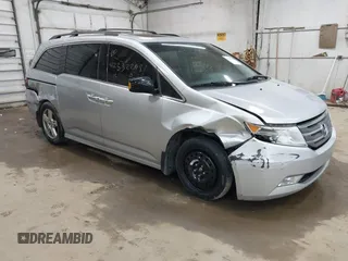 2012 Honda Odyssey Touring с VIN 5FNRL5H99CB052361, выставлен на аукционе IAAI как лот 42332298 с пробегом 185 914 миль миль и . История ставок и продаж доступна на DreamBid. Изображение 1.