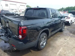 2023 Honda Ridgeline RTL-E with VIN 5FPYK3F76PB042100, listed as a IAAI auction lot 42274861 with 16,822 mi miles and . Bid and sale history available at DreamBid. Image 4.