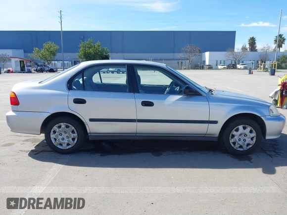 1999 Honda Civic LX with VIN JHMEJ6670XS000958, listed as a IAAI auction lot 41620949 with 93,698 mi miles and . Bid and sale history available at DreamBid. Image 13.