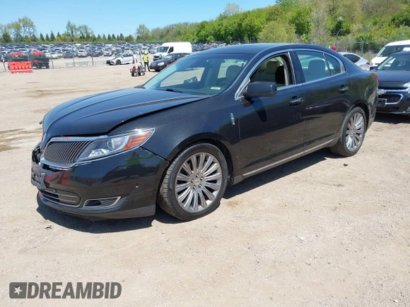 2013 Lincoln MKS z VIN 1LNHL9EK3DG617815, wystawiony jako IAAI lot #42239784 z przebiegiem 122 589 mil mil oraz . Historia ofert i sprzedaży dostępna na DreamBid. Obrazek 2.