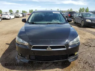 2009 Mitsubishi Lancer z VIN JA3AX88W99U613116, wystawiony jako Copart lot #58765855 z przebiegiem 256 289 mil mil oraz Czysty tytuł • Clean title. Historia ofert i sprzedaży dostępna na DreamBid. Obrazek 5.