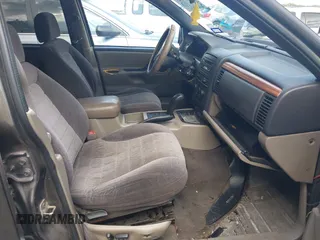 1999 Jeep Grand Cherokee Laredo with VIN 1J4GW58S2XC524365, listed as a IAAI auction lot 42432625 with 284,942 mi miles and . Bid and sale history available at DreamBid. Image 5.