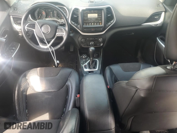 2018 Jeep Cherokee Latitude Plus с VIN 1C4PJMLX9JD597624, выставлен на аукционе Copart как лот 64314295 с пробегом 76 608 миль миль и Списание • Salvage title. История ставок и продаж доступна на DreamBid. Изображение 8.