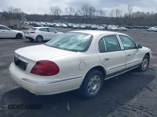 1998 Lincoln Continental with VIN 1LNFM97V2WY738814, listed as a IAAI auction lot 41992844 with 147,066 mi miles. Bid and sale history available at carsss.com. Image 4.