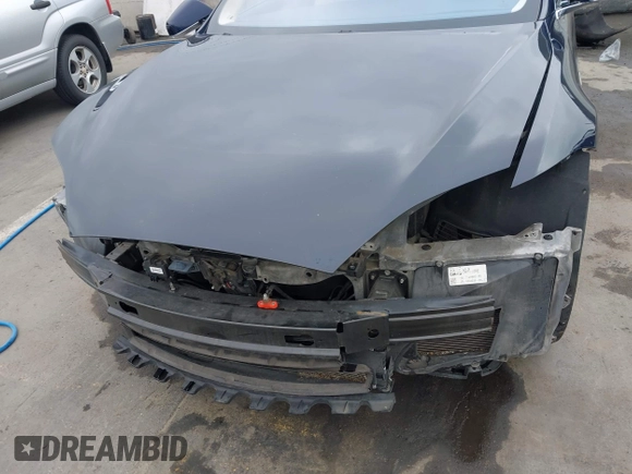 2014 Tesla Model S 60 with VIN 5YJSA1H10EFP30234, listed as a IAAI auction lot 42182249 with 186,654 mi miles and . Bid and sale history available at DreamBid. Image 6.