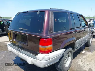 1997 Jeep Grand Cherokee TSi with VIN 1J4FX58S2VC747897, listed as a IAAI auction lot 42033868 with 119,924 mi miles. Bid and sale history available at carsss.com. Image 4.
