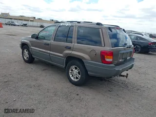 2002 Jeep Grand Cherokee Laredo with VIN 1J4GW48S32C123720, listed as a IAAI auction lot 41909204 with 157,996 mi miles. Bid and sale history available at carsss.com. Image 3.