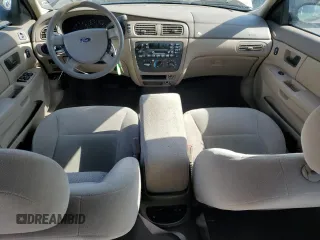 2005 Ford Taurus SE z VIN 1FAFP53215A212736, wystawiony jako Copart lot #58439495 z przebiegiem Nie podano mil oraz Szkoda całkowita • Salvage title. Historia ofert i sprzedaży dostępna na DreamBid. Obrazek 8.