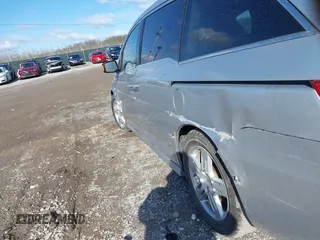2011 Honda Odyssey Touring with VIN 5FNRL5H92BB049901, listed as a IAAI auction lot 41985224 with 101,957 mi miles and . Bid and sale history available at DreamBid. Image 6.