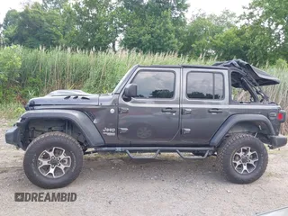 2020 Jeep Wrangler Unlimited Sport S with VIN 1C4HJXDN7LW113735, listed as a IAAI auction lot 42639884 with 48,736 mi miles and . Bid and sale history available at DreamBid. Image 14.