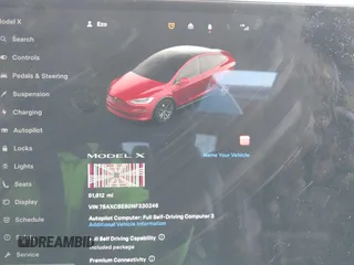 2022 Tesla Model X Plaid with VIN 7SAXCBE60NF330246, listed as a IAAI auction lot 41477394 with 51,612 mi miles and . Bid and sale history available at carsss.com. Image 7.