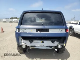 2023 Rivian R1S Adventure z VIN 7PDSGBBA5PN024306, wystawiony jako Copart lot #53980375 z przebiegiem 10 389 mil mil oraz Szkoda całkowita • Salvage title. Historia ofert i sprzedaży dostępna na DreamBid. Obrazek 6.