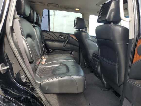 2015 Infiniti QX80 z VIN JN8AZ2ND5F9770320, wystawiony jako Copart lot #55305965 z przebiegiem 168 832 mil mil oraz Czysty tytuł • Clean title. Historia ofert i sprzedaży dostępna na DreamBid. Obrazek 11.