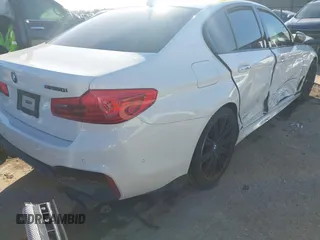 2018 BMW 5 Series M550i xDrive with VIN WBAJB9C54JB050218, listed as a IAAI auction lot 41132695 with 69,659 mi miles. Bid and sale history available at carsss.com. Image 4.