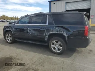 2019 Chevrolet Suburban LS z VIN 1GNSCGKC2KR297407, wystawiony jako Copart lot #75224194 z przebiegiem 93 562 mil mil oraz Szkoda całkowita • Salvage title. Historia ofert i sprzedaży dostępna na DreamBid. Obrazek 2.