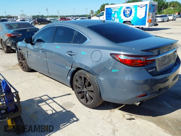 2021 Mazda 6 Carbon Edition with VIN JM1GL1WY4M1619533, listed as a IAAI auction lot 41979213 with 84,783 mi miles and . Bid and sale history available at DreamBid. Image 3.