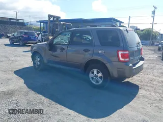 2011 Ford Escape XLT with VIN 1FMCU0D79BKB79697, listed as a IAAI auction lot 41265677 with 138,026 mi miles. Bid and sale history available at carsss.com. Image 3.