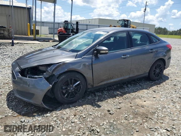 2016 Ford Focus SE with VIN 1FADP3F29GL233719, listed as a Copart auction lot 56857705 with 140,785 mi miles and Salvage title. Bid and sale history available at DreamBid. Image 1.