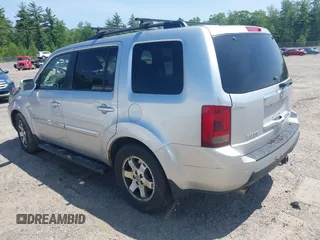 2010 Honda Pilot Touring z VIN 5FNYF4H94AB010058, wystawiony jako IAAI lot #42495313 z przebiegiem 157 306 mil mil oraz . Historia ofert i sprzedaży dostępna na DreamBid. Obrazek 3.