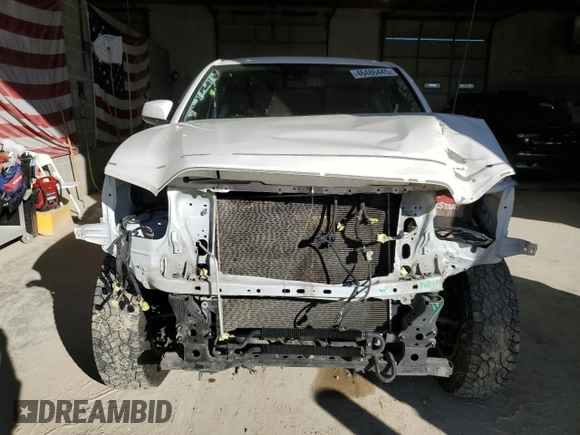 2021 Toyota Tacoma 4WD SR5 with VIN 3TMDZ5BN4MM103311, listed as a Copart auction lot 46486445 with 125,685 mi miles and Salvage Title. Bid and sale history available at carsss.com. Image 5.