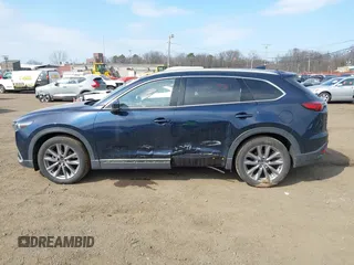 2021 Mazda CX-9 Grand Touring with VIN JM3TCBDY7M0540359, listed as a IAAI auction lot 41711366 with 47,391 mi miles and . Bid and sale history available at carsss.com. Image 14.