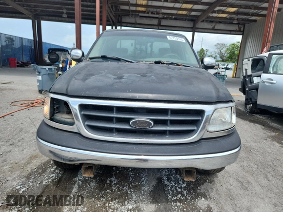 2001 Ford F-150 XL with VIN 1FTRX17L51NA83857, listed as a Copart auction lot 62759145 with 215,961 mi miles and Salvage title. Bid and sale history available at DreamBid. Image 5.