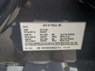 2024 Tesla Model Y z VIN 7SAYGDED4RA331714, wystawiony jako Copart lot #57043915 z przebiegiem Nie podano mil oraz Szkoda całkowita • Salvage title. Historia ofert i sprzedaży dostępna na DreamBid. Obrazek 13.