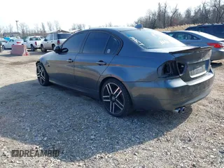2007 BMW 3 Series 328xi with VIN WBAVC93587K031632, listed as a IAAI auction lot 41711350 with 184,703 mi miles. Bid and sale history available at carsss.com. Image 3.