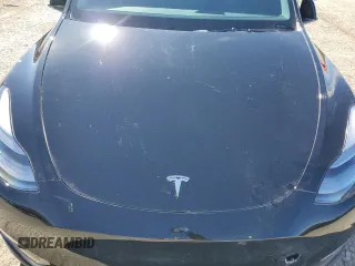 2023 Tesla Model Y Performance with VIN 7SAYGDEF8PF925238, listed as a Copart auction lot 46276925 with 28,201 mi miles and Salvage Title. Bid and sale history available at DreamBid. Image 11.