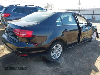 2015 Volkswagen Jetta SE z VIN 3VWD07AJ3FM266598, wystawiony jako IAAI lot #41757080 z przebiegiem 127 815 mil mil oraz . Historia ofert i sprzedaży dostępna na DreamBid. Obrazek 4.