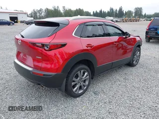 2023 Mazda CX-30 S Premium with VIN 3MVDMBDM1PM520048, listed as a IAAI auction lot 42468172 with 7,277 mi miles and . Bid and sale history available at DreamBid. Image 4.