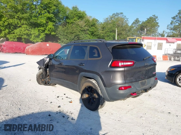 2018 Jeep Cherokee Trailhawk with VIN 1C4PJMBX7JD517299, listed as a IAAI auction lot 42022770 with 62,865 mi miles. Bid and sale history available at carsss.com. Image 3.