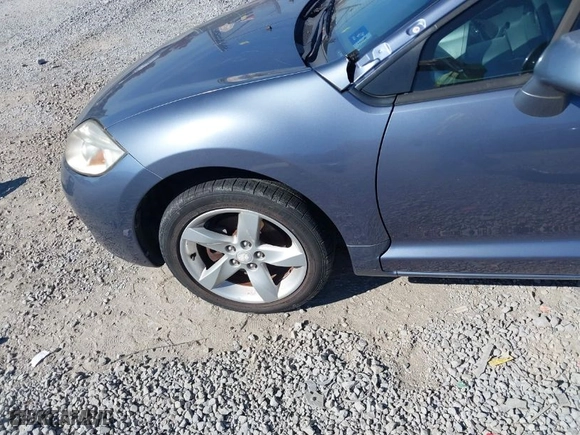 2007 Mitsubishi Eclipse GS with VIN 4A3AK24F67E060304, listed as a IAAI auction lot 40709276 with 113,801 mi miles. Bid and sale history available at carsss.com. Image 6.