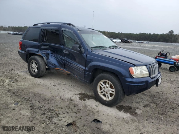 2004 Jeep Grand Cherokee Laredo with VIN 1J4GX48S64C165105, listed as a Copart auction lot 50301455 with 299,686 mi miles and Salvage Title. Bid and sale history available at carsss.com. Image 4.