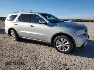 2013 Dodge Durango Crew with VIN 1C4SDHDT0DC590172, listed as a Copart auction lot 80140034 with 135,078 mi miles and Salvage title. Bid and sale history available at DreamBid. Image 4.