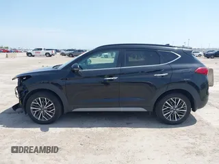 2021 Hyundai Tucson Ultimate with VIN KM8J33ALXMU289579, listed as a IAAI auction lot 42027719 with 95,989 mi miles and . Bid and sale history available at DreamBid. Image 14.