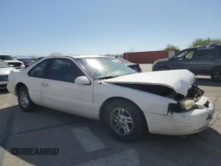 1996 Ford Thunderbird LX z VIN 1FALP62W7TH119284, wystawiony jako Copart lot #71701084 z przebiegiem 239 462 mil mil oraz Szkoda całkowita • Salvage title. Historia ofert i sprzedaży dostępna na DreamBid. Obrazek 4.