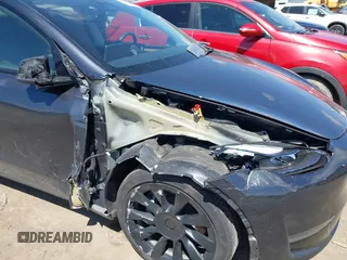 2024 Tesla Model Y Long Range with VIN 7SAYGAEE4RF078906, listed as a IAAI auction lot 42051207 with Not Provided miles and . Bid and sale history available at DreamBid. Image 6.