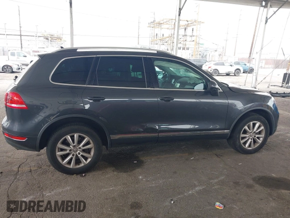 2014 Volkswagen Touareg Sport with VIN WVGEF9BP0ED015273, listed as a IAAI auction lot 42046823 with 84,694 mi miles and . Bid and sale history available at DreamBid. Image 13.