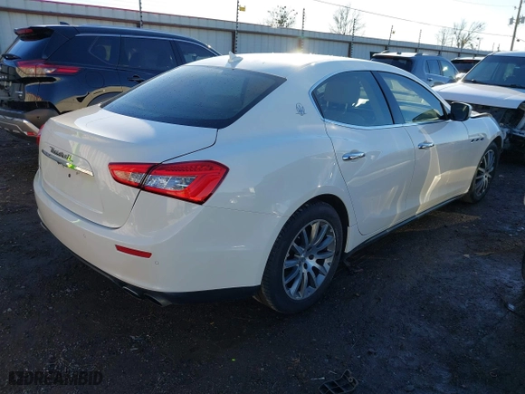 2014 Maserati Ghibli S Q4 with VIN ZAM57RTA1E1096387, listed as a IAAI auction lot 41424049 with 100,970 mi miles. Bid and sale history available at carsss.com. Image 4.