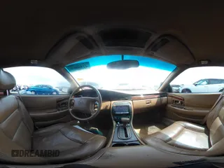 1999 Cadillac Eldorado ESC z VIN 1G6EL12Y5XU603764, wystawiony jako IAAI lot #42368692 z przebiegiem 154 613 mil mil oraz . Historia ofert i sprzedaży dostępna na DreamBid. Obrazek 18.