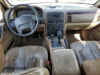 2000 Jeep Grand Cherokee Laredo with VIN 1J4GW48S6YC304447, listed as a Copart auction lot 58001035 with Not provided miles and Clean title. Bid and sale history available at DreamBid. Image 8.