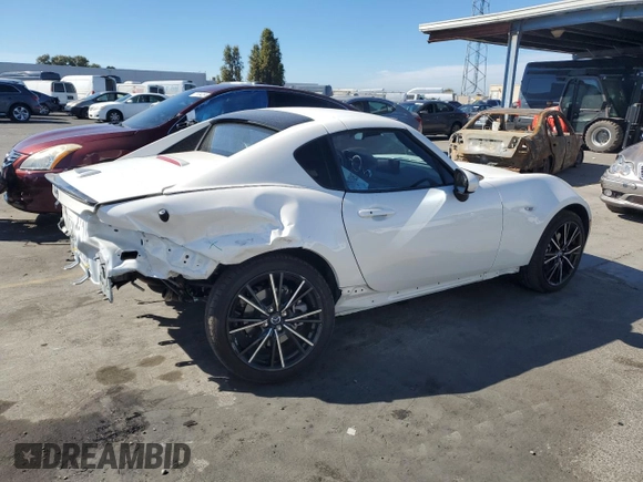 2024 Mazda MX-5 Miata Grand Touring z VIN JM1NDAM76R0602972, wystawiony jako Copart lot #77665904 z przebiegiem 4 965 mil mil oraz Szkoda całkowita • Salvage title. Historia ofert i sprzedaży dostępna na DreamBid. Obrazek 3.