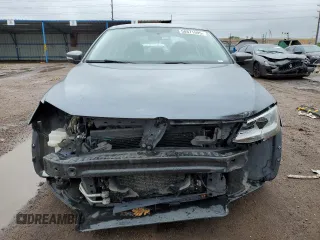 2012 Volkswagen Jetta SE z VIN 3VWDX7AJ7CM124472, wystawiony jako Copart lot #58871595 z przebiegiem 143 563 mil mil oraz Czysty tytuł • Clean title. Historia ofert i sprzedaży dostępna na DreamBid. Obrazek 5.
