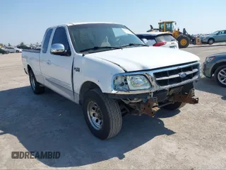 1997 Ford F-150 with VIN 1FTDX1766VKD15586, listed as a IAAI auction lot 41371717 with 236,683 mi miles and . Bid and sale history available at DreamBid. Image 1.