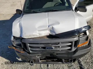 2000 Ford Super Duty F-250 XL with VIN 1FTNF20F9YEC91357, listed as a Copart auction lot 76673234 with 318,306 mi miles and Salvage Title. Bid and sale history available at carsss.com. Image 11.