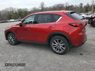 2021 Mazda CX-5 Grand Touring Reserve with VIN JM3KFBAY3M0315640, listed as a Copart auction lot 51004955 with 21,981 mi miles and Salvage Title. Bid and sale history available at DreamBid. Image 2.